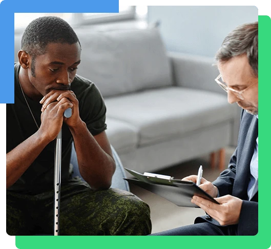 Depressed young adult African American soldier with walking stick treating PTSD with psychotherapy sessions